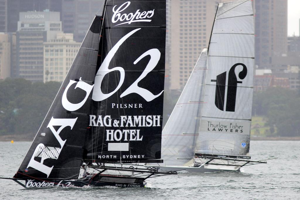 Coopers 62-Rag and Famish Hotel and Thurlow Fisher Lawyers had their own personal dual all day - 18ft Skiffs  NSW Championship, Race one  Sunday, 11 January 2015  Sydney Harbour. © Australian 18 Footers League http://www.18footers.com.au